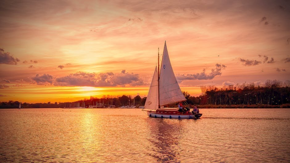 Sailboat on the Norfolk Broads at sunset, England