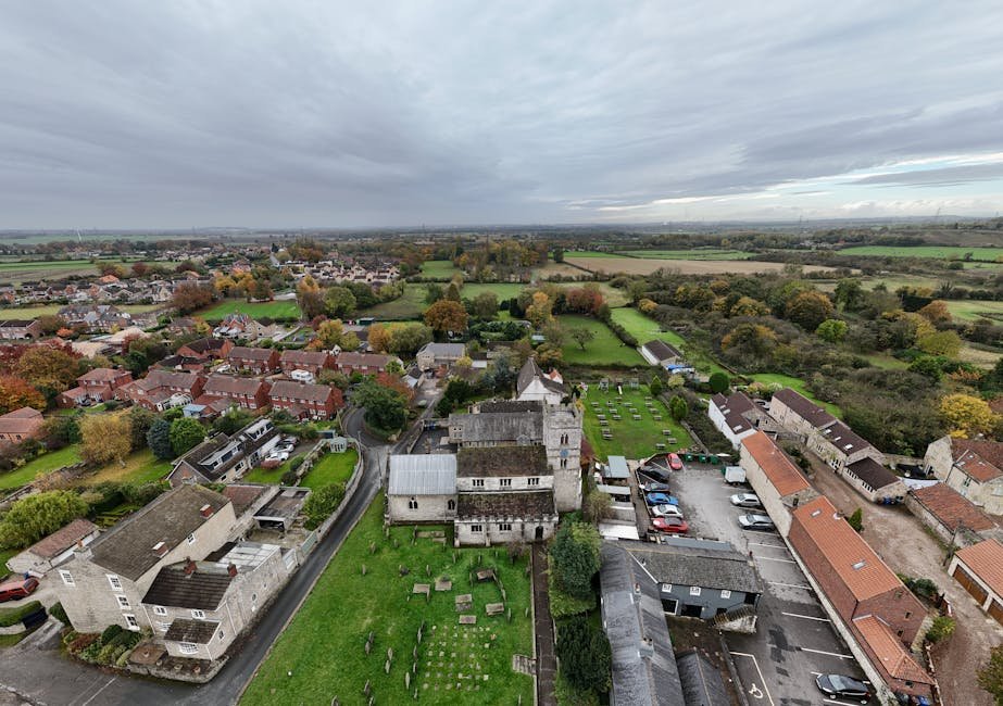 Aerial view of a village surrounded by countryside