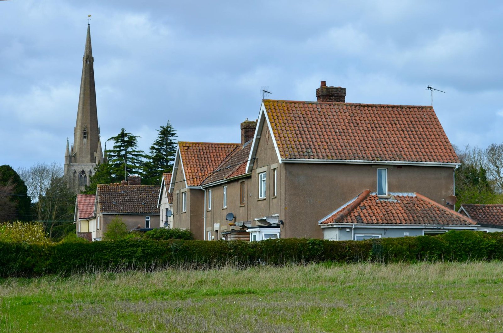 Norfolk coast with beach huts and golden sandy shore